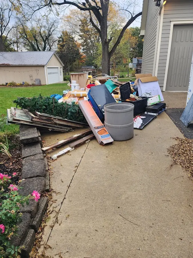 Dumpster being loaded with debris for 3 Yard Dumpster Rental in Chena Ridge